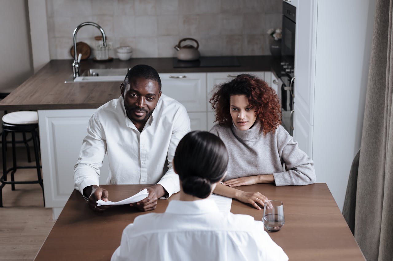 Couple listening attentively to the Woman in front